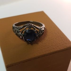 Black gold and sapphire ring